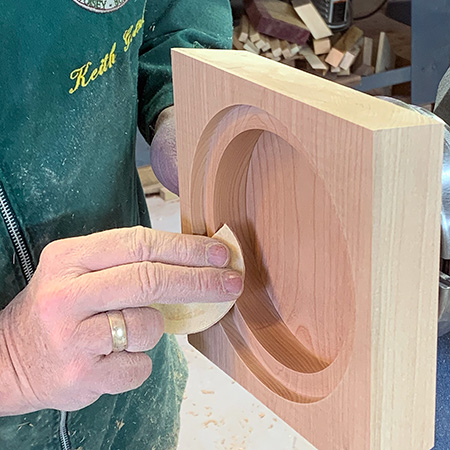 Hand sanding lid lip of manhole box