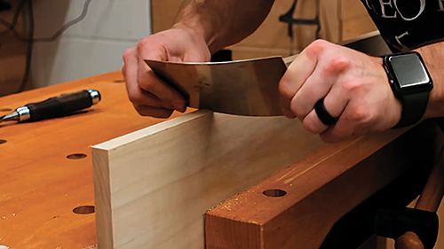 Finishing drawer handle cutout with a card scraper