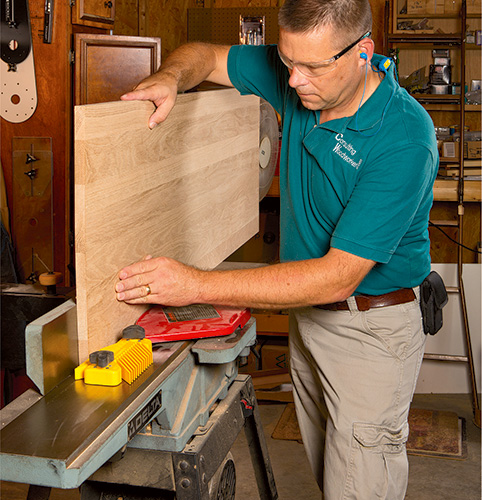 Running desk panel through jointer