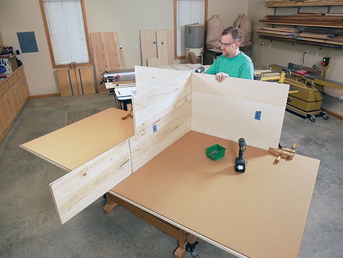 Attaching bottom panel of miter saw station