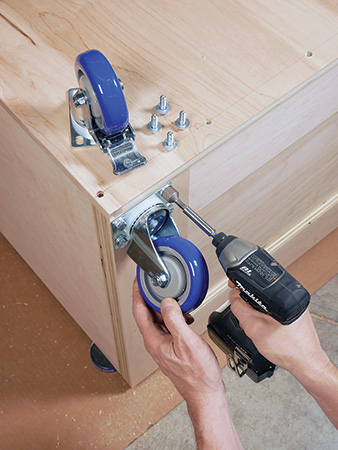 Attaching casters to the base of miter saw station