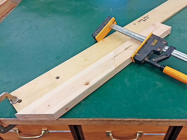 Clamping workpiece to scrap wood rail