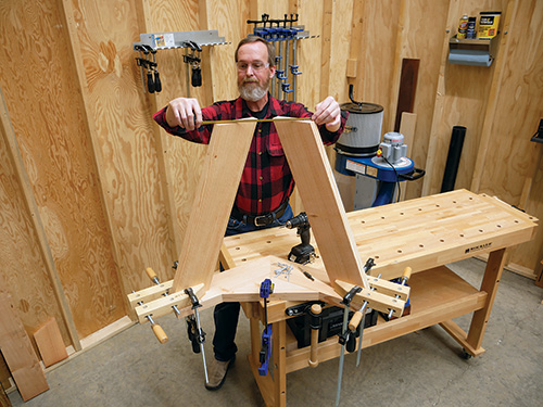 Measuring gab between parts of mobile lathe stand's legs