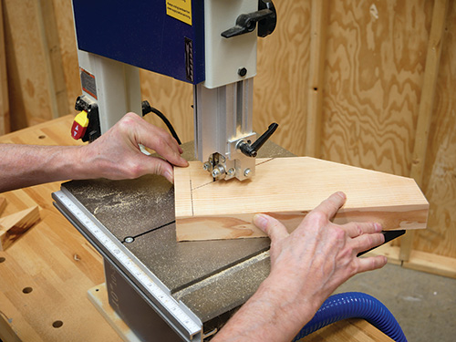 Cutting mobile lathe stand upper gusset at band saw