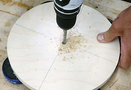 Drilling clock hand hole in center of clock face