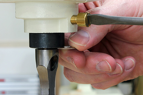 Dime spacer when installing mortising chisel on a mortiser