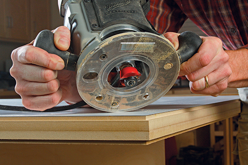 A top rabbet, routed into both the laminate and MDF, completes the “tongue” that will lock the wood edging in place around the cart’s top.