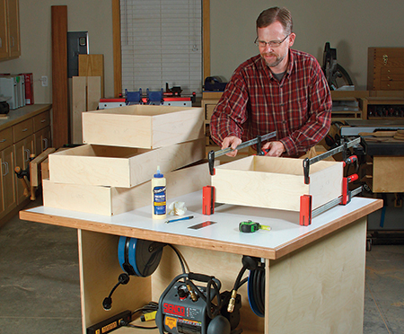 Assemble the fronts, backs, sides and bottoms of each drawer box in one glue-up. All the connecting surfaces receive glue — even the drawer bottom rabbets. The resulting boxes are simple to make and extremely durable.