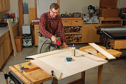 Miter-cut and attach four cleats around the bottom panel to stiffen it and build up the edges for the caster lag screws. A test piece can help you adjust your miter saw accurately for cutting tight-fi tting corners here.