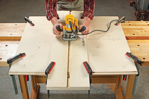 A simple clamp-on jig with an 11/16"-wide center slot guided the author’s router and 1/2"-diameter piloted mortising bit (inset) to mill perfect-width, straight dadoes. It’s a foolproof solution for this application.