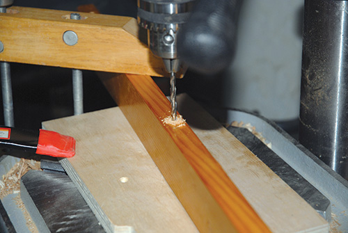 Drilling holes in stretchers for connecting them to console casework