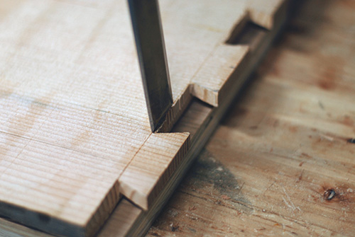 Cutting waste from a dovetail with a chisel