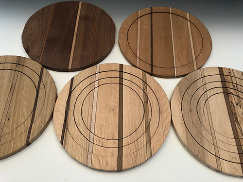 Five sibling turning blanks with rings cut by jigsaw