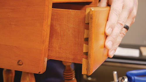 Close-up of maple table drawer dovetail joinery