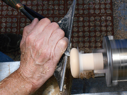 Complete the turning of the paper towel roll cap