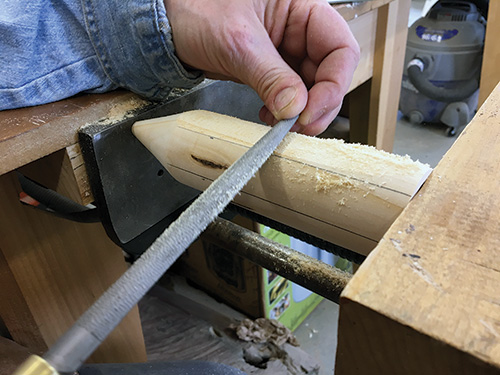 Cutting down pencil box flat segments with a rasp