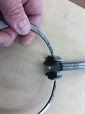 Measuring diameter of Forstner bit with calipers