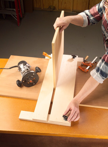 Squeeze a piece of the shelf material between the fixed and adjustable legs. Lock the adjustable leg in place. 