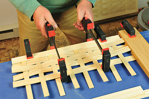 Clamping basket weaving segments in place