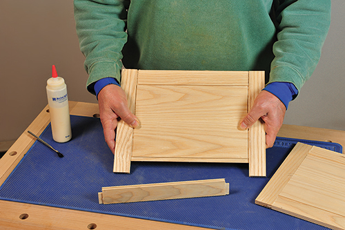 Putting together panels and frame for picnic basket lid