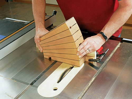 Cutting foot grooves in base of knife block