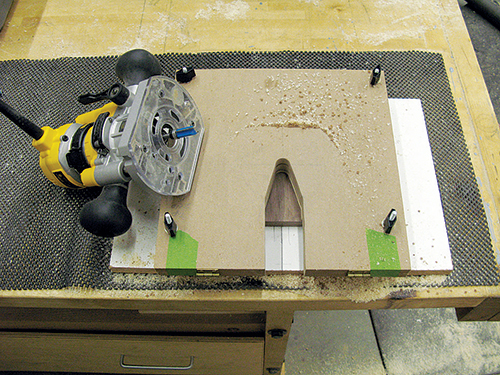 The key to routing the two-part recess for the pizza cutter in each half of the storage blocks is a special routing jig with interchangeable templates.