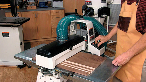 Putting pizza peel panel through drum sander