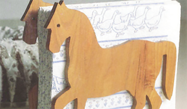 Napkin holder with pony shaped cut-outs