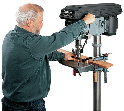 Drilling counterbored holes in portable outdoor chair slats with a drill press