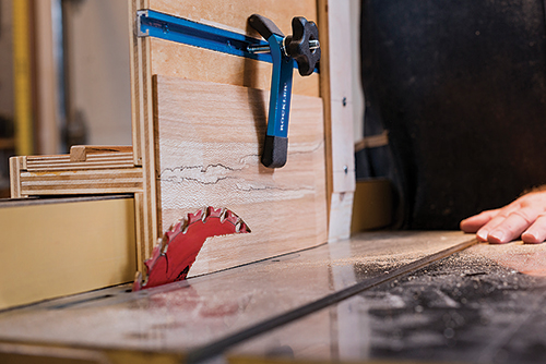 Close-up of bevel cutting jig on table saw.