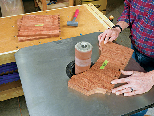 Smoothing curved foot for printer stand with spindle sander