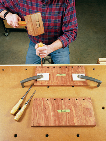 Using mallet and chisel to clean up dovetail sockets