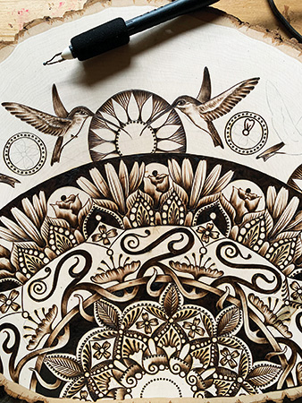 Hummingbird themed pyrography drawing