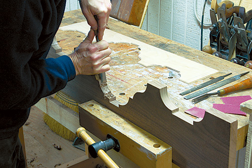 Using a chisel to clean saw marks off of queen anne highboy case