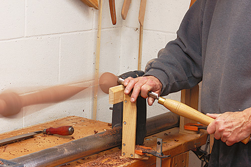 Turning feet for queen anne highboy on lathe