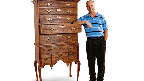 Kerry Pierce standing alongside queen anne highboy