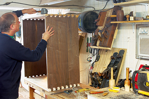 Test fitting dovetail joints in Queen Anne highboy dovetails