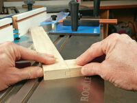 Test fitting rail-and-stile joint cut on a router