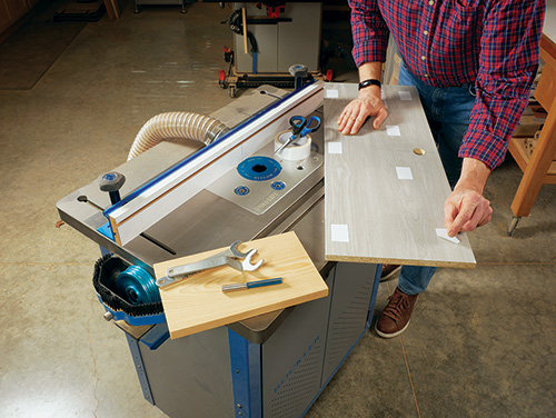 Attaching shim board to router table