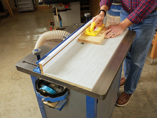 Scrap board adds height to router table top