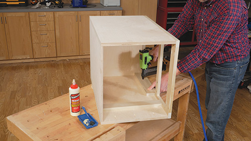 Nailing drawer mounting plate into cabinet carcass