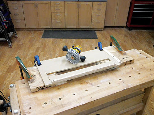 Shop-made plunge router jig for cutting space in interior of coffee table
