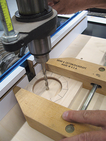Drilling through clock face to set hands
