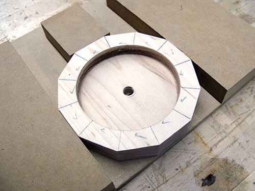 Test fitting clock face in routing jig