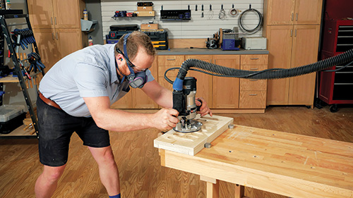 Template routing a mancala gameboard with a dish-carving bit.