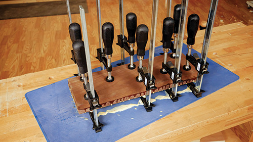 Gluing up laminated hardwood for making a gameboard 