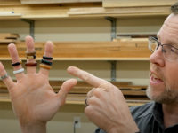 Chris Marshall shows off several turned wood rings