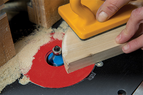 Smoothing shelf edges with router bit