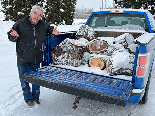 Rob loading walnut wood into his truck