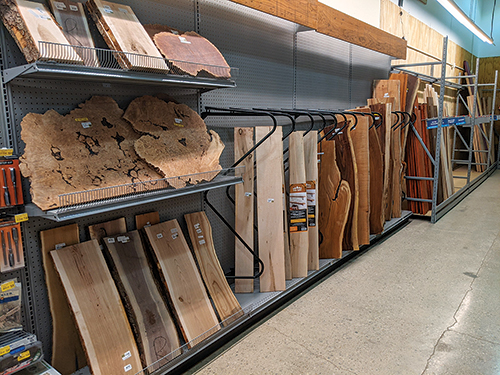 Selection of live edge and slab lumber at a Rockler store